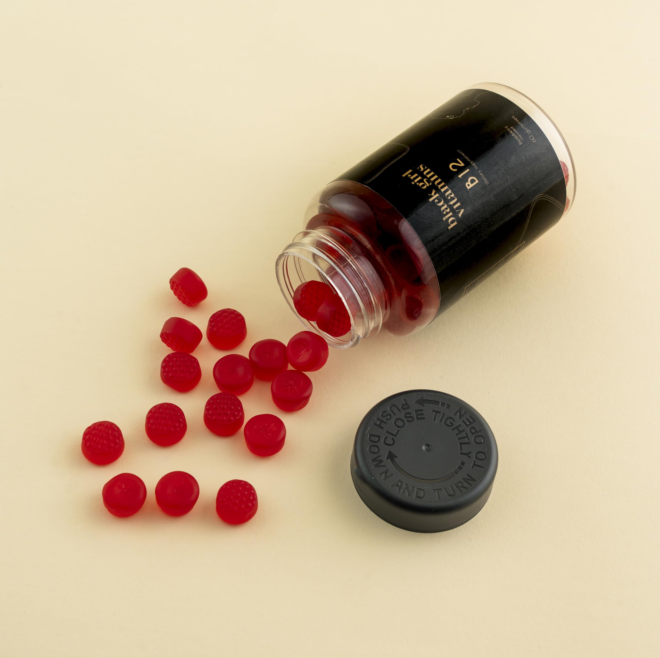 Close-up of Black Girl Vitamins B12 Gummies highlighting energy support.