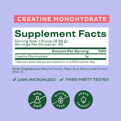 Bloom Nutrition Creatine Monohydrate scoop beside jar enables easy 5 g servings.