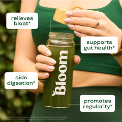 Green juice mix with beet root powder in glass by Bloom Nutrition