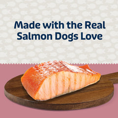 Dog enjoying Blue Bits Salmon Morsels provides tasty daily reward