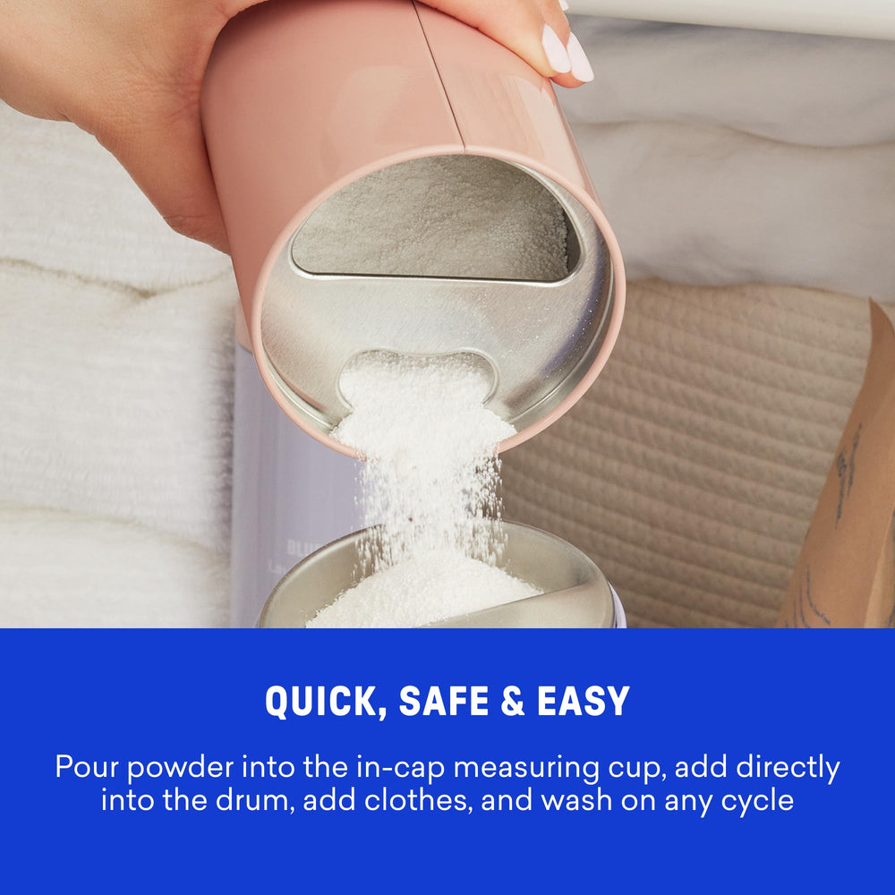 Plastic-free BLUELAND packaging highlighted beside powder