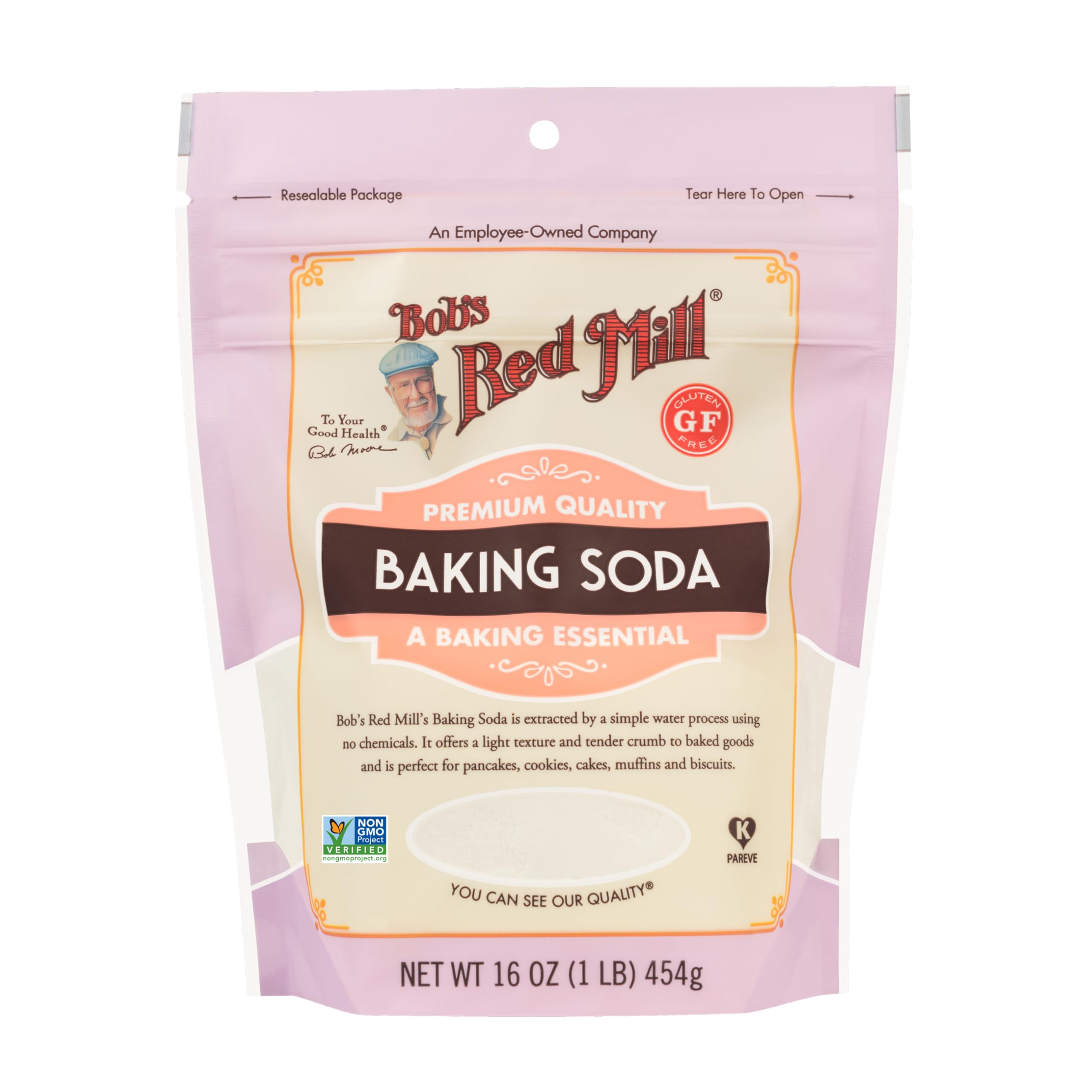 Pouring Bob's Red Mill baking soda into batter for rise.