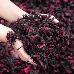 Close-up of Bombala dried hibiscus flowers with vibrant red petals.