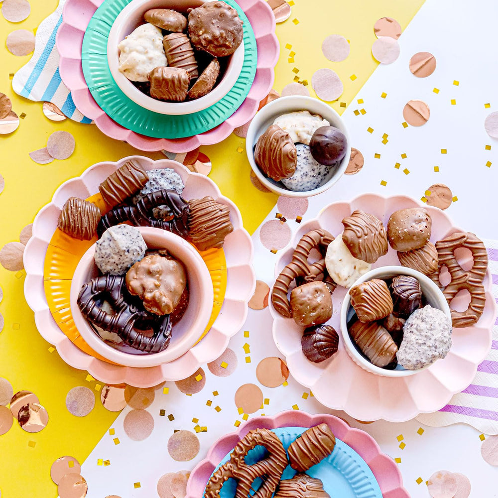 BONNIE AND POP cashew clusters and nut bites in a decorative gift tin.