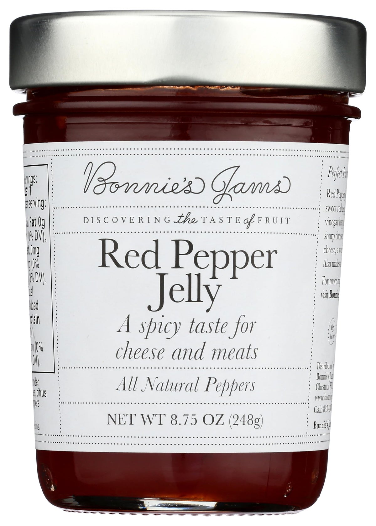 Bonnie's Jams Red Pepper Jelly jar on a cheese board for pairing.