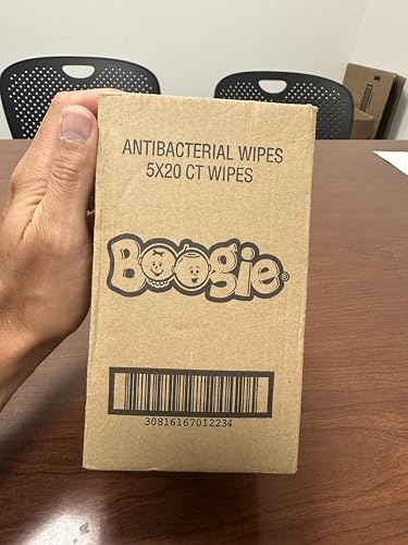 Boogie wipes family use scene shows kids and adults with moisturized hands