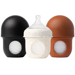 Boon Nursh bottle with reusable silicone pouch for easy cleanups.