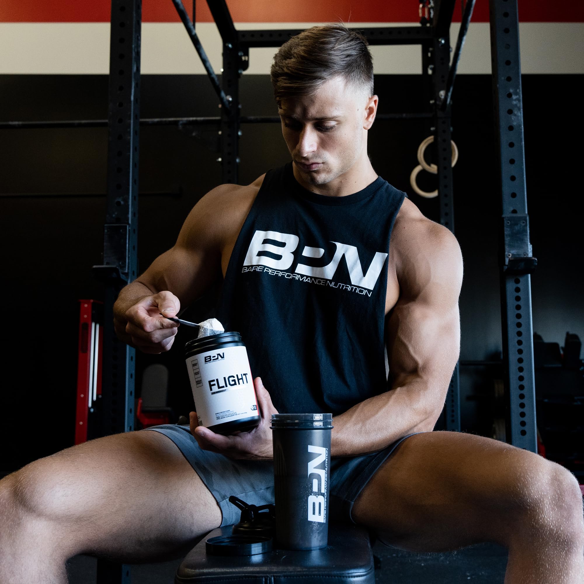 BPN Flight bottle in gym setting implying on-the-go pre-workout energy.