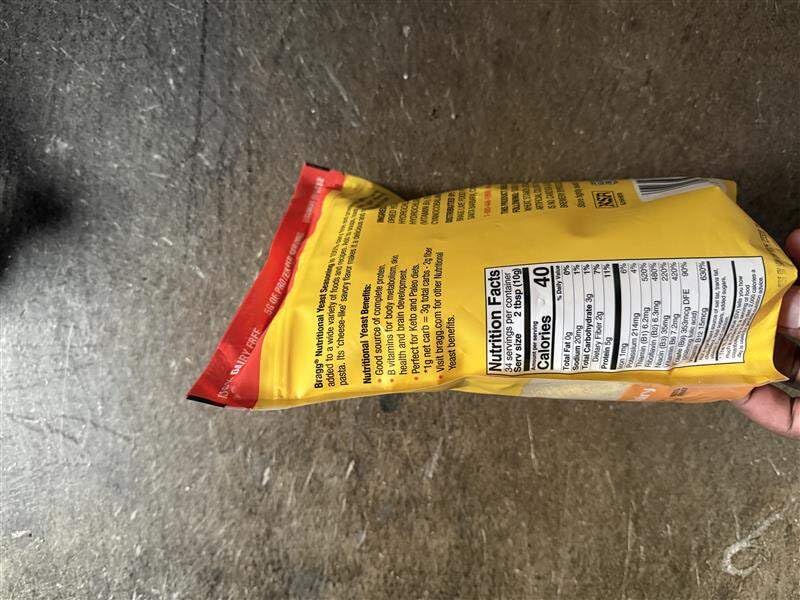 Bragg Nutritional Yeast Seasoning close-up texture showing flaky crystals