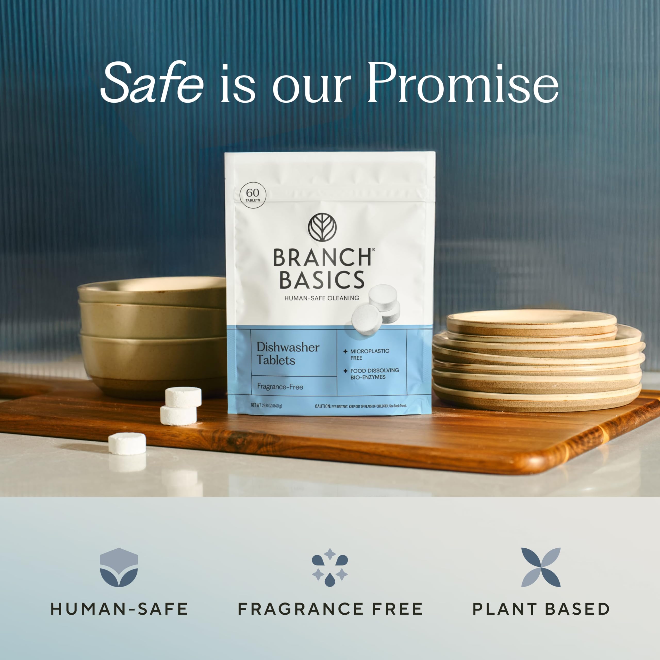 Branch Basics dishwasher tablets with plant-based formula shown dissolving in water.