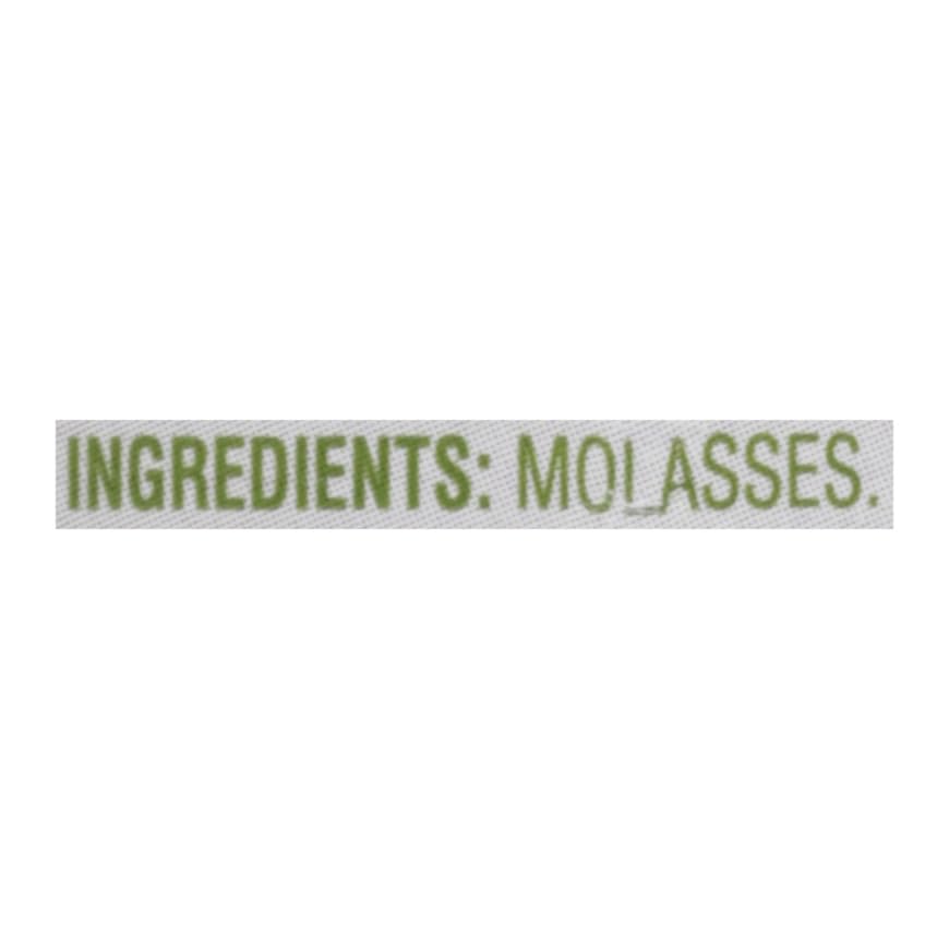 Brer Rabbit molasses pouring on spoon highlighting thick texture for recipes