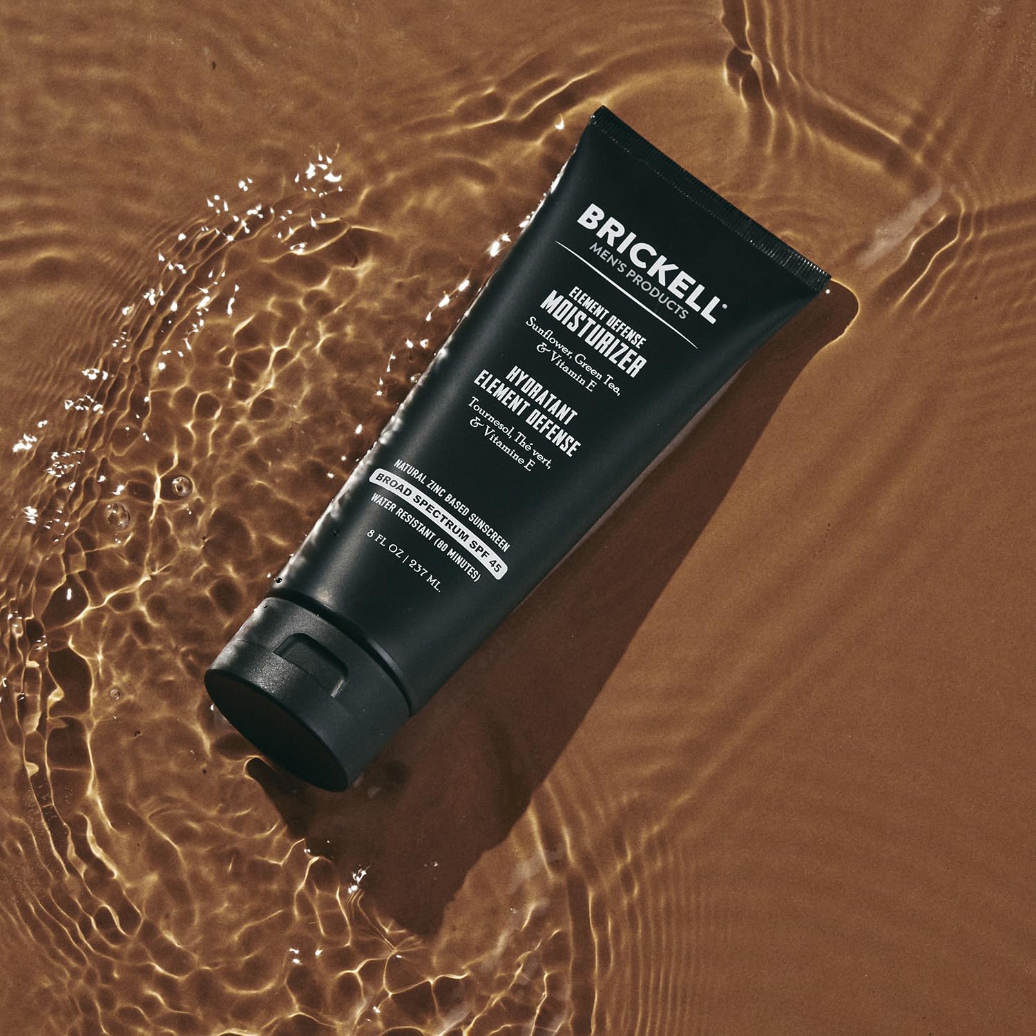 Brickell Element Defense SPF45 application scene; easy rub-in without white residue.