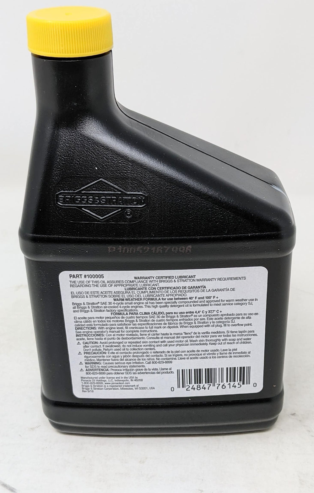 Briggs & Stratton fuel treatment bottle ready to condition fuel for smoother operation.