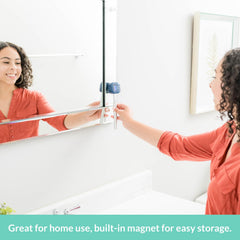 Bril UV-C Toothbrush Sanitizer magnetic holder mounted on a mirror saves counter space.