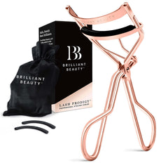Brilliant Beauty eyelash curler in rose gold close-up showing precise lift without pinching.