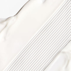 Briogeo Don't Despair, Repair cream texture highlights silky slip for styling.