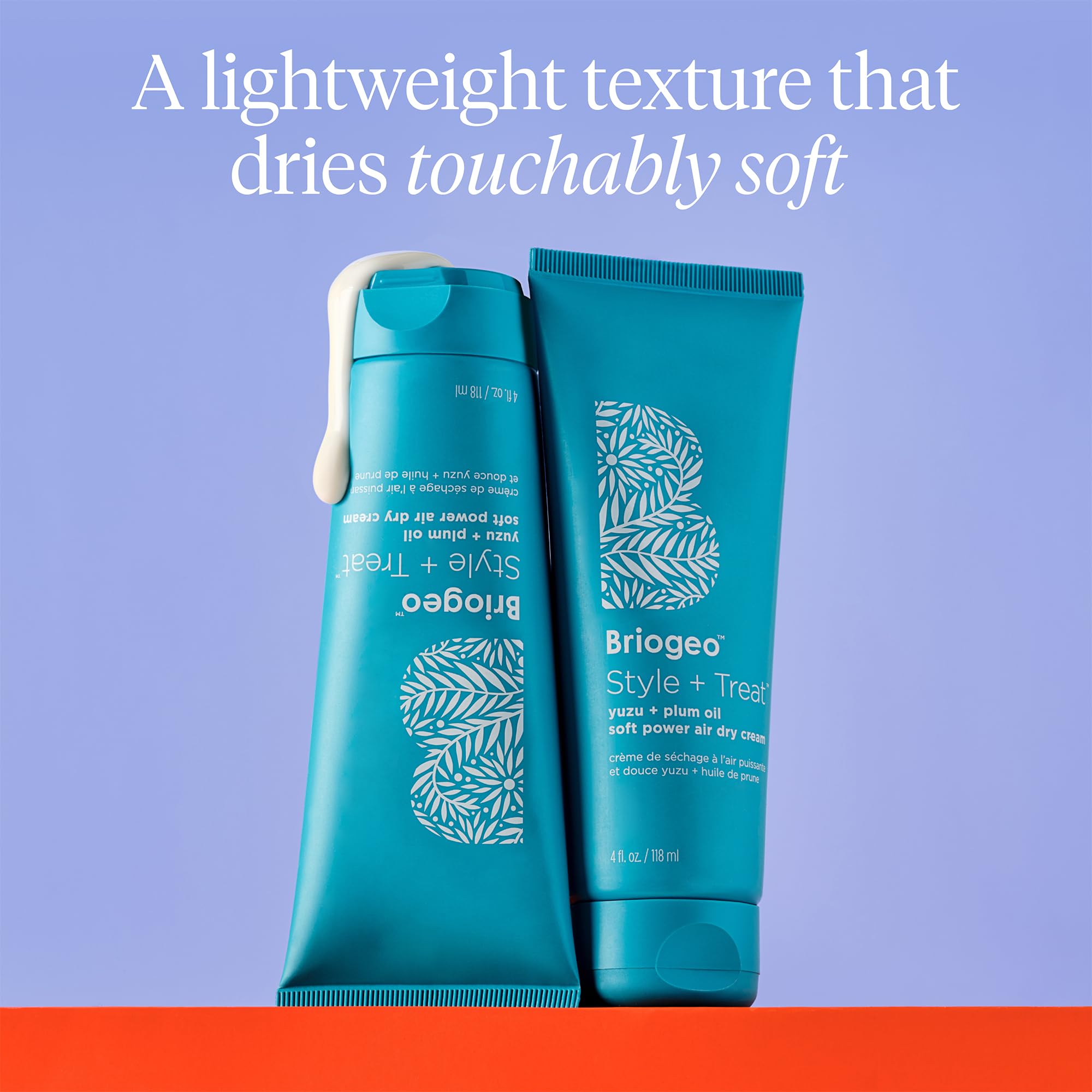 Briogeo Style Treat Yuzu and Plum Oil Air Dry Cream bottle and waves