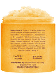 Brooklyn Botany Peach Bellini scrub jar in shower ready to cleanse and hydrate.