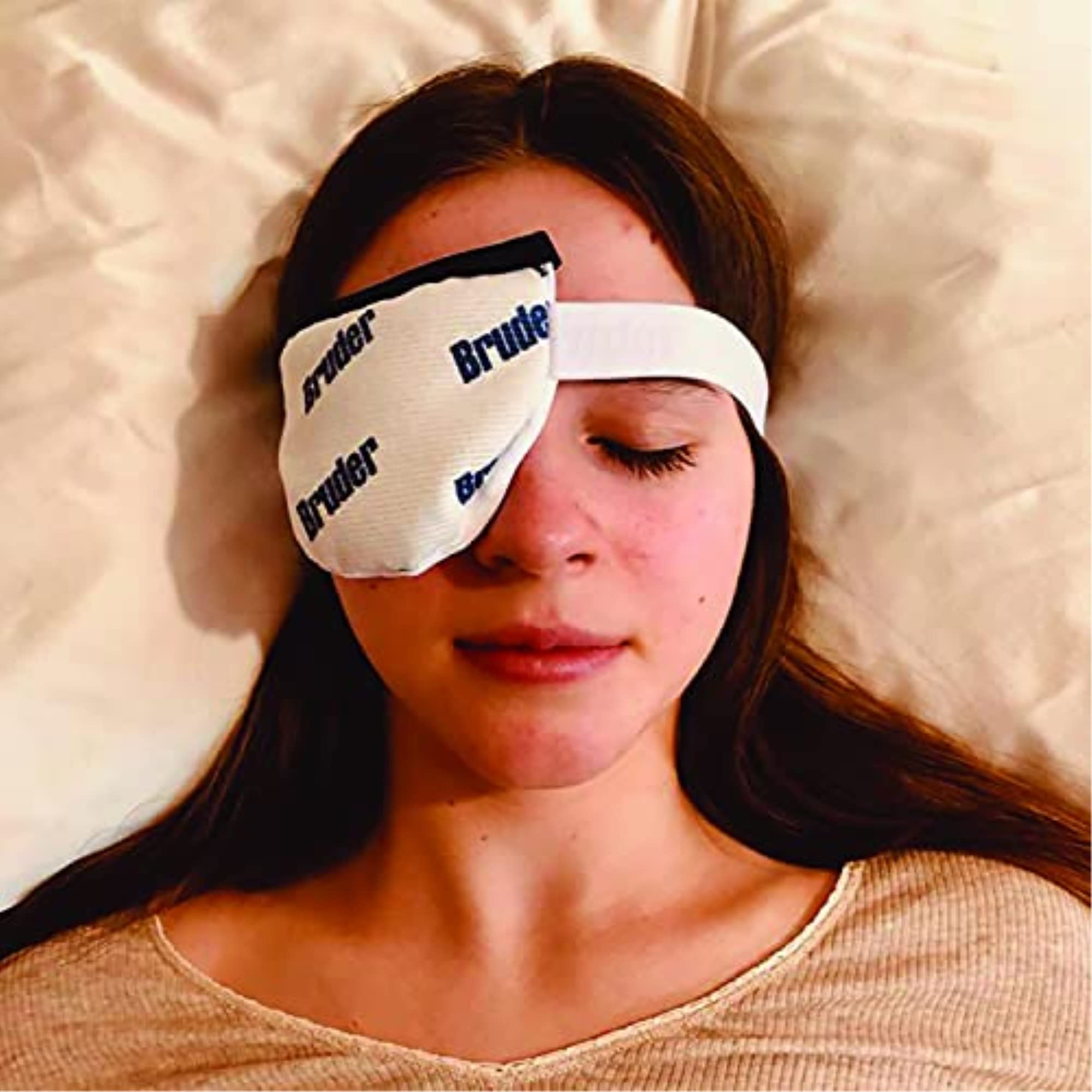 Bruder Eye Compress applied to the eyelid for potential irritation relief.