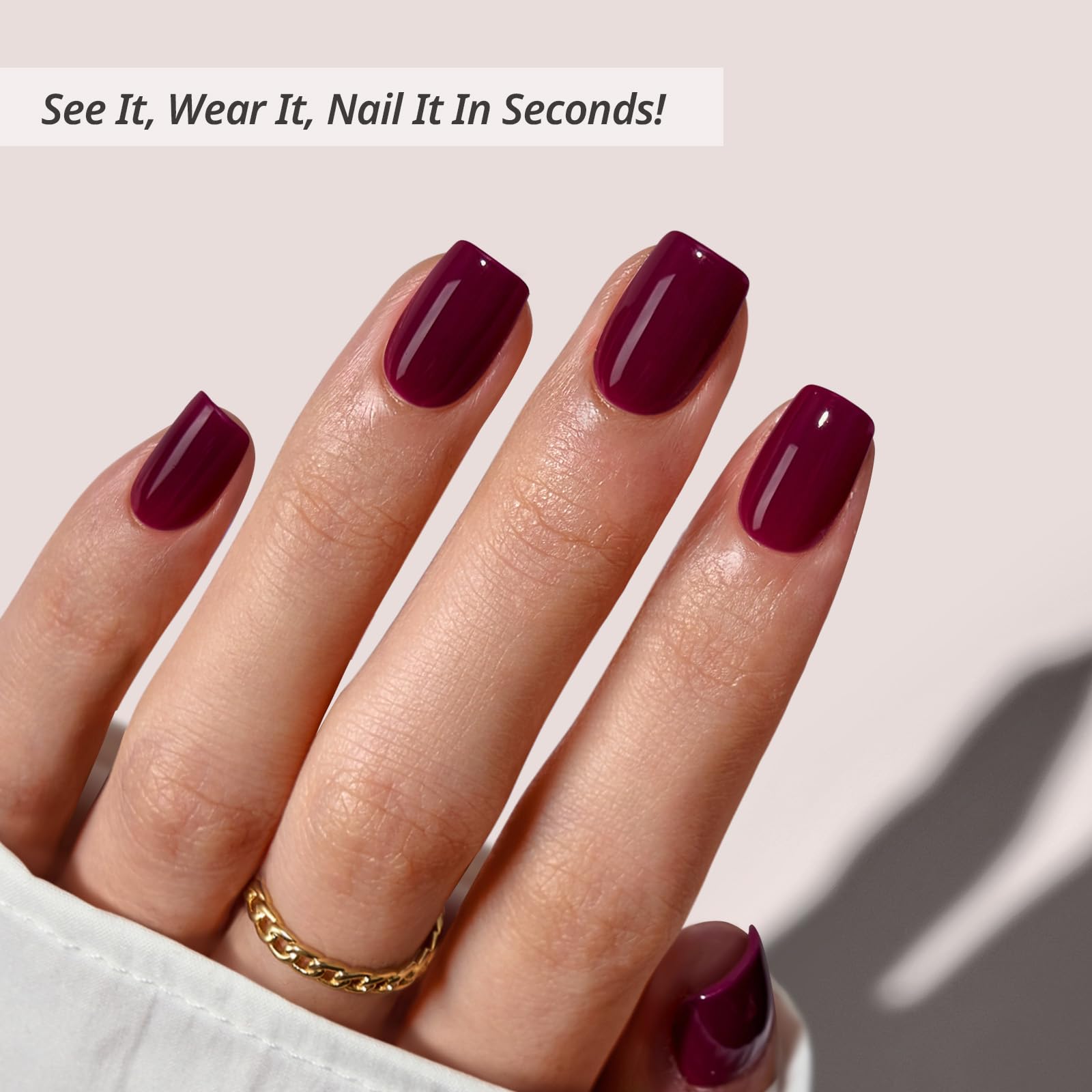 BTArtbox plum red squoval nails applying on hand