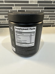 Bucked Up Pre Workout grape being poured into a glass for mixing.