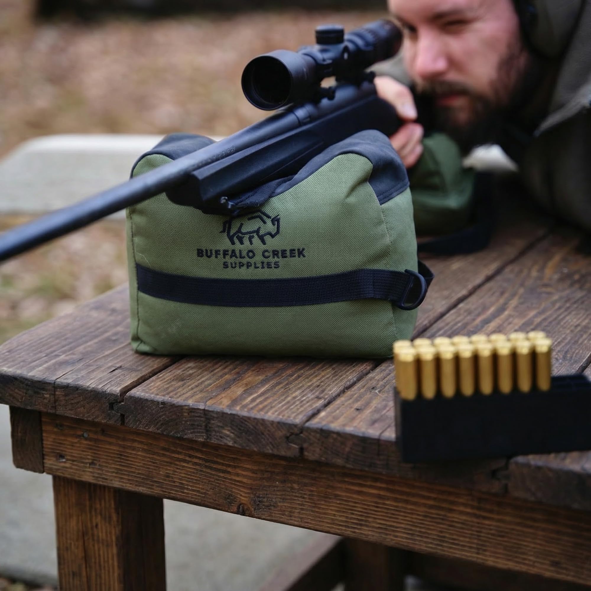 Buffalo Creek Supplies olive drab range setup showing two bags on a bench.