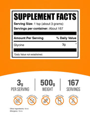 BulkSupplements Glycine powder being poured into a glass for easy mixing.