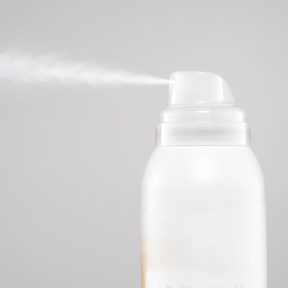 Blondish tinted dry shampoo on roots refreshing color for blonde to light brown hair