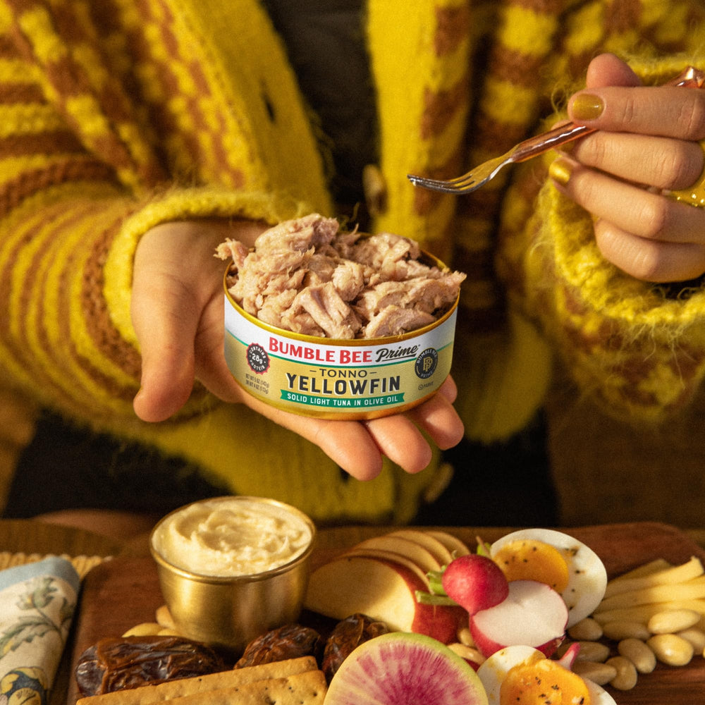 Bumble Bee Prime Tonno tuna on salad, protein-packed greens topping.