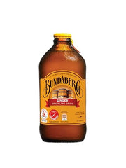 Bundaberg Ginger Beer chilled glass pour, refreshing cold drink.