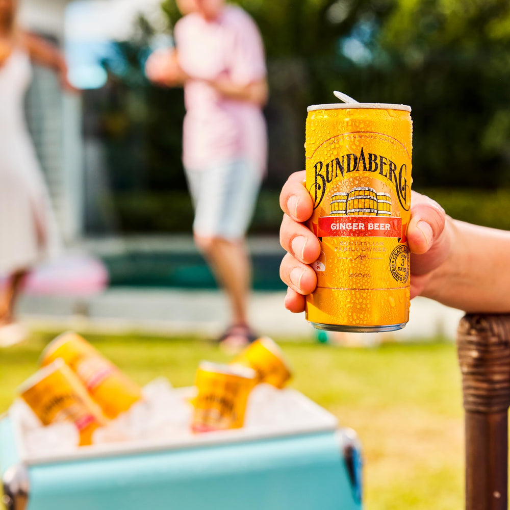 Chilled Bundaberg Ginger Beer poured over ice in a glass