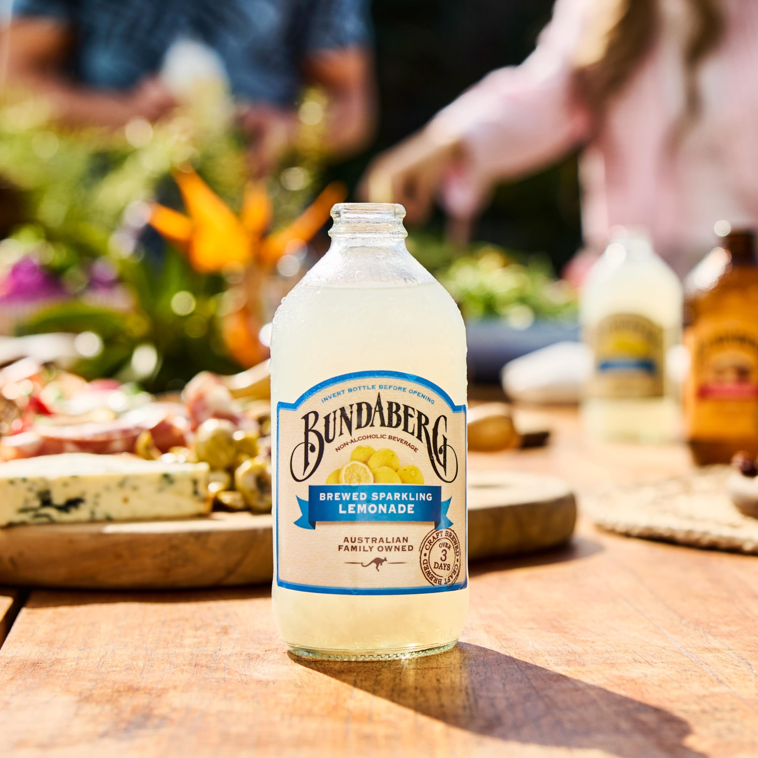 Table setting with Bundaberg bottles and glasses, ideal for a casual meal.