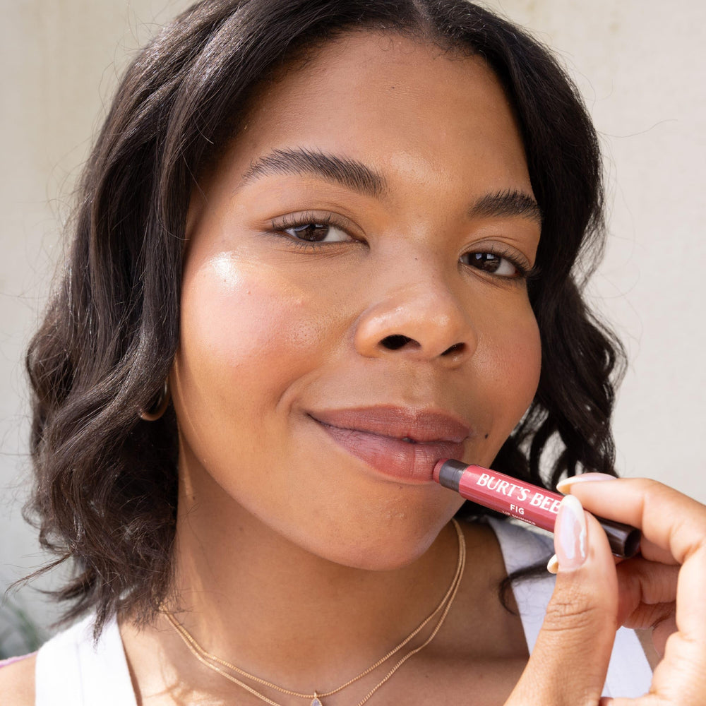 Burt's Bees Lip Shimmer Plum closeup showing peppermint freshness.