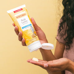 Label close-up shows natural ingredients in Burt’s Bees lotion
