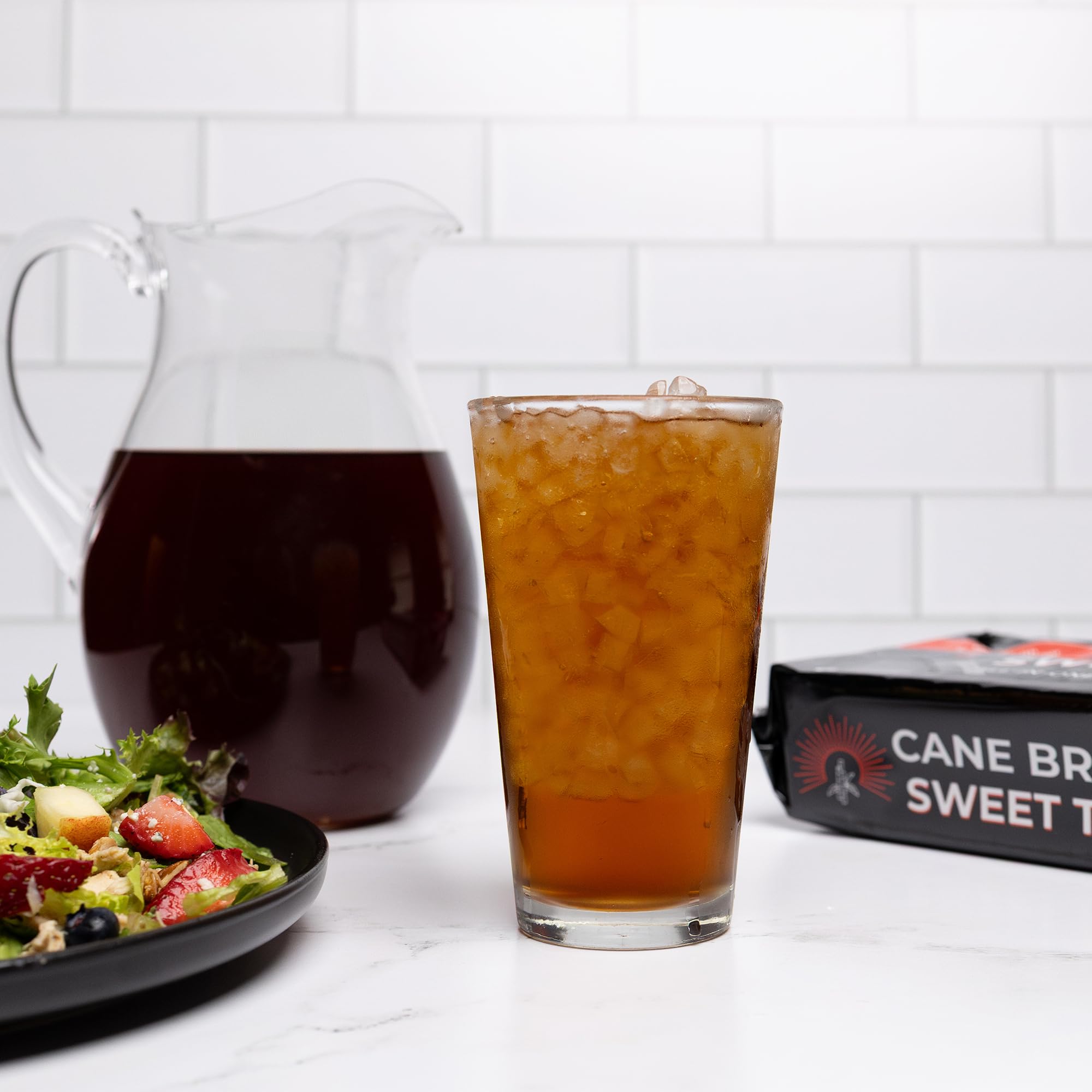Cane Brew Sweet Tea family enjoying a tall glass together.