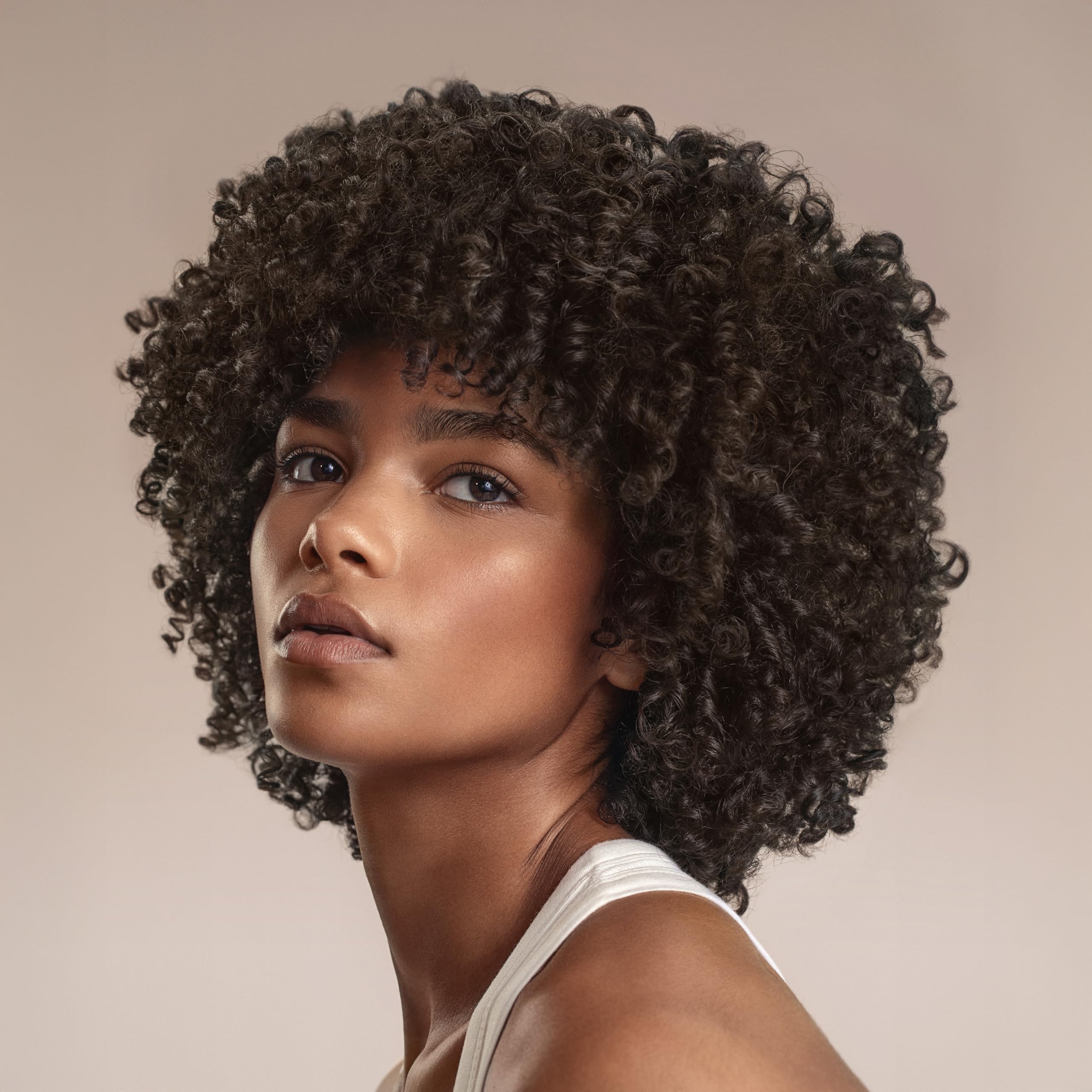 Creamy texture close-up of Cantu Ultra Moisture Mask delivering rich hydration.