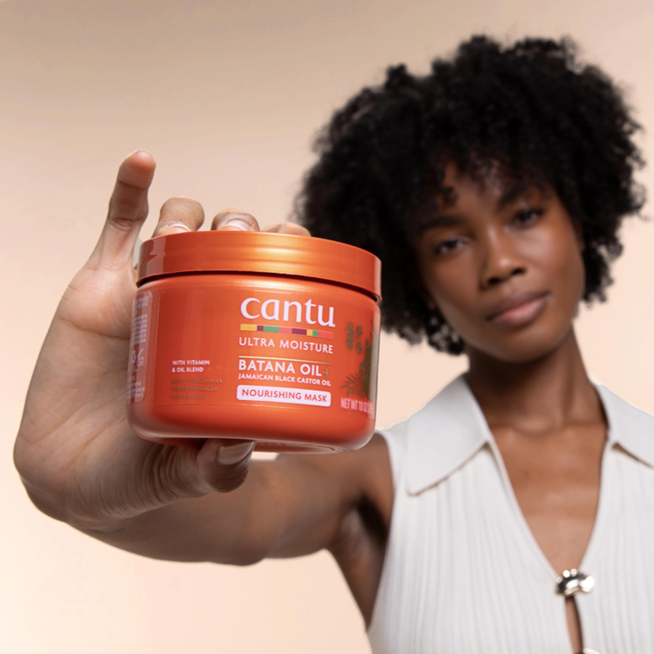Applying the mask on damp hair shows softening and improved manageability.