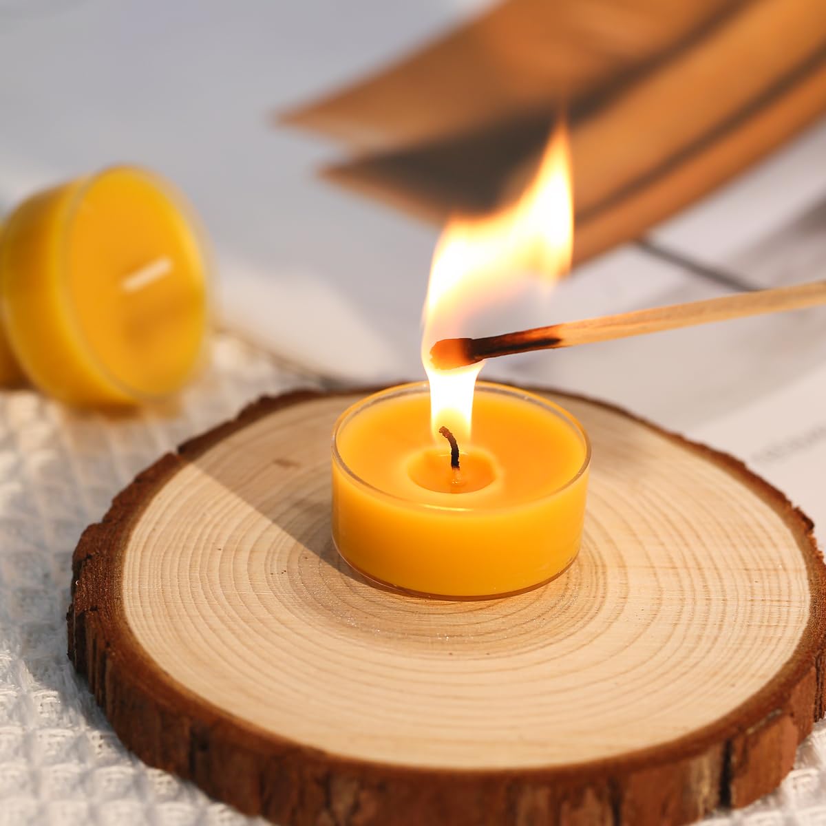 Capaniel tealights in reusable cups help keep surfaces clean.