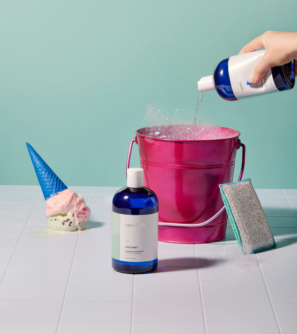 Capri Blue Volcano label close-up emphasizes essential oils and natural cleaning formula.