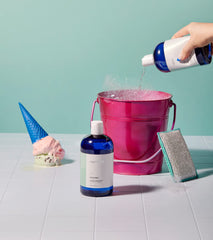 Capri Blue Volcano label close-up emphasizes essential oils and natural cleaning formula.