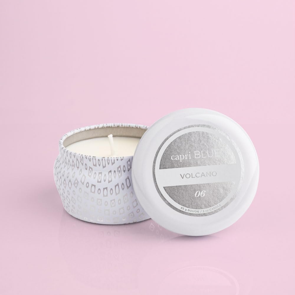 Capri Blue Volcano White mini tin candle fragrance tones evoke tropical fruits and citrus.