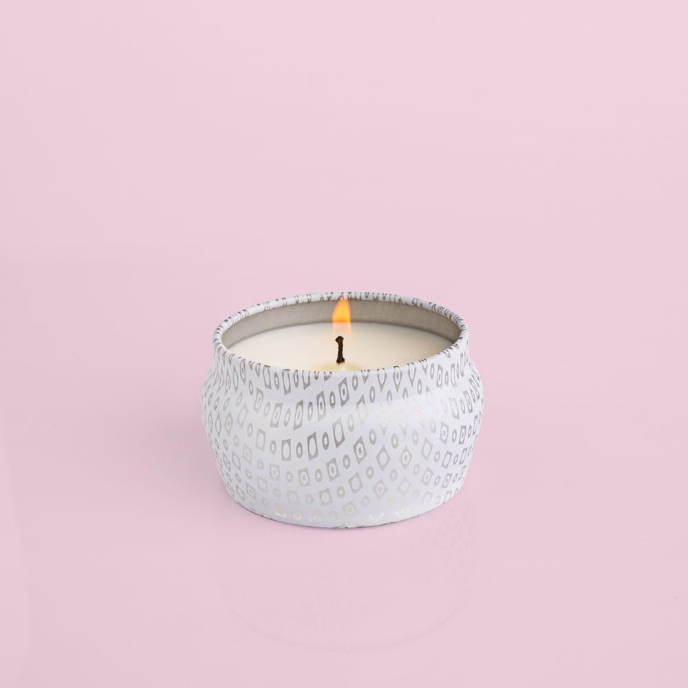 Capri Blue Volcano White mini tin candle display on a shelf for gifting.