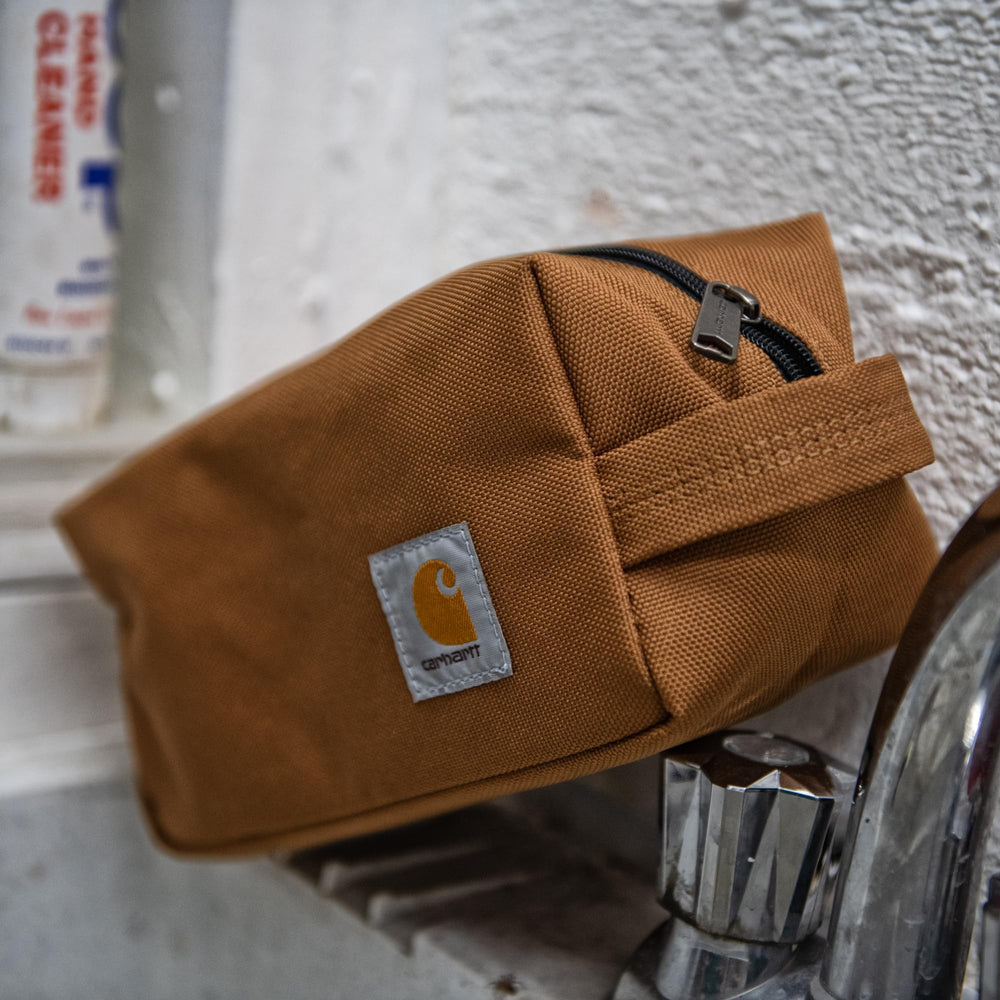 Carhartt durable travel kit dimensions 9x4.5x4.5 inches show compact packing footprint.