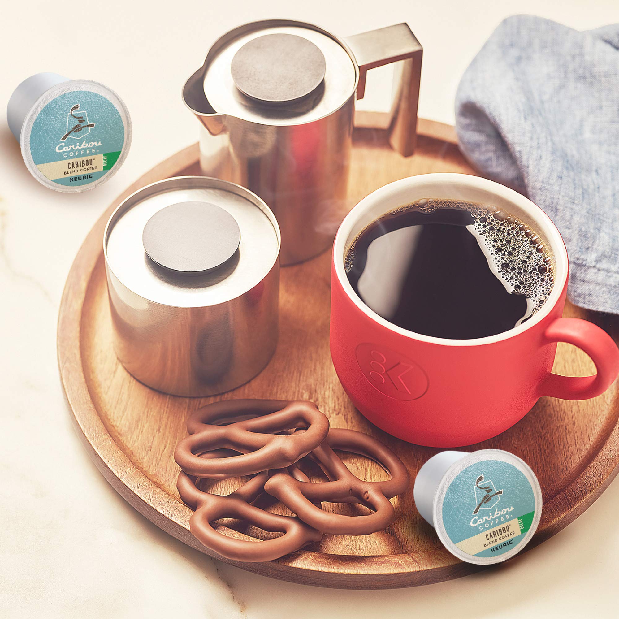 Caribou Blend Decaf shown in a mug with silky foam