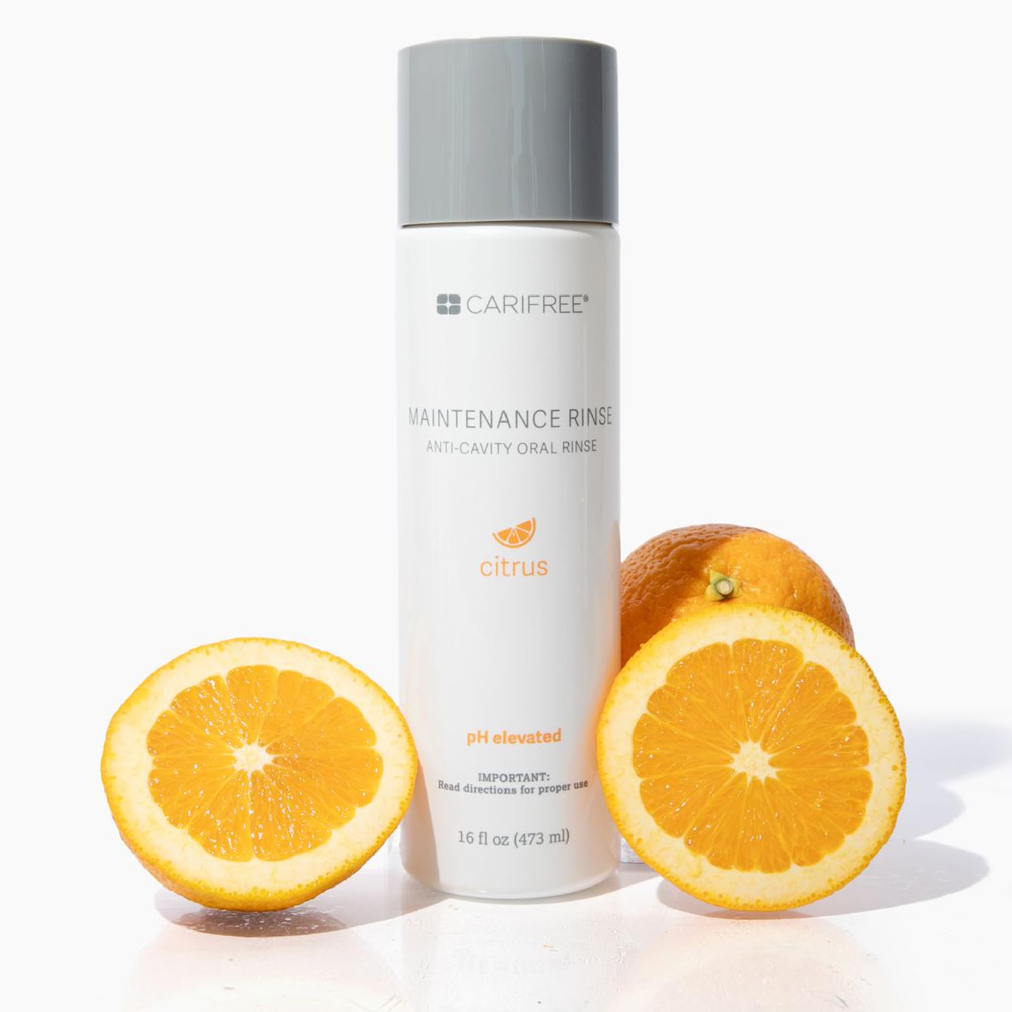 CariFree Maintenance Rinse cap and bottle scene conveys convenient daily use.