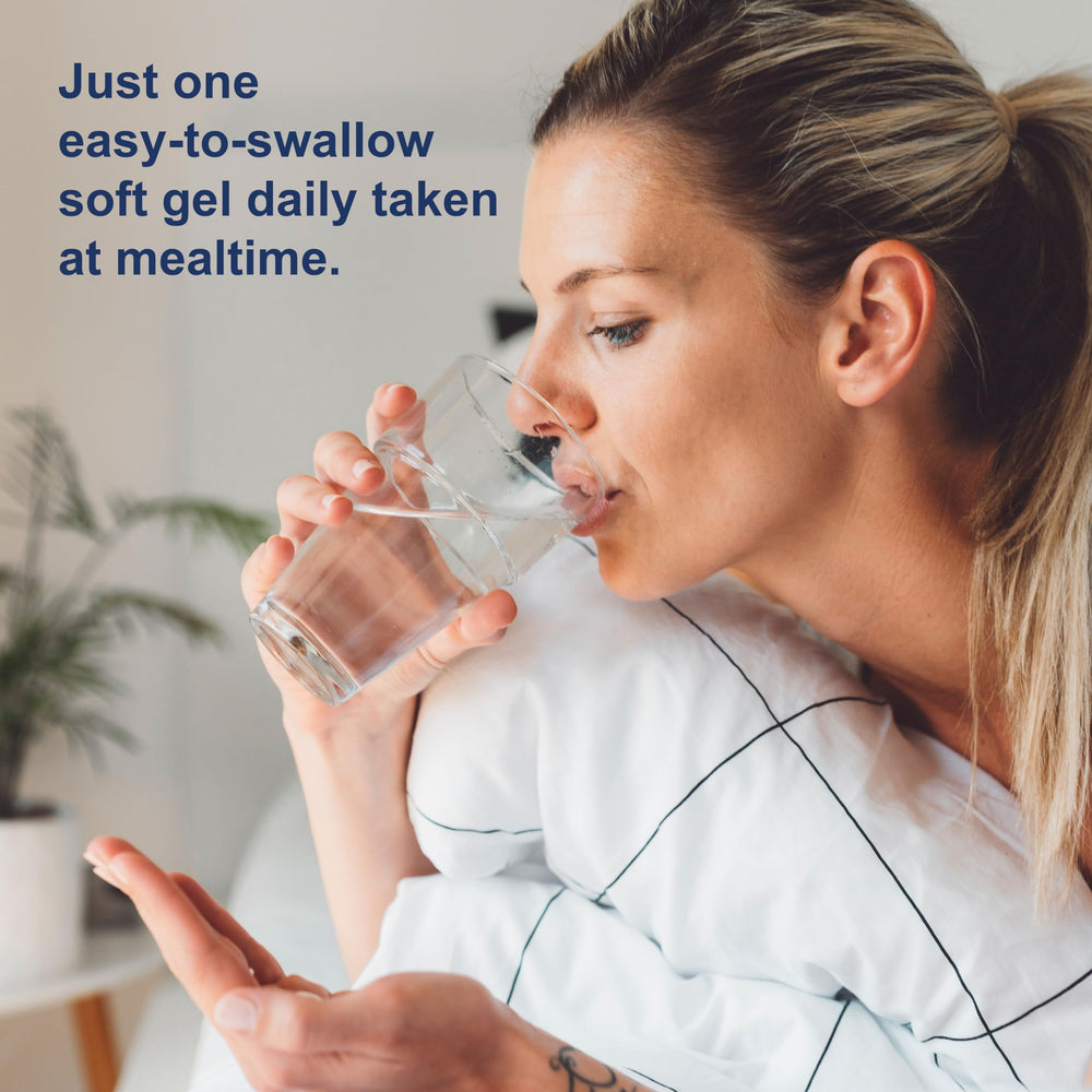 Glass of water beside Carlson Magnesium Gels bottle for daily use