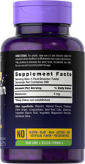 Carlyle Melatonin berry-flavored tablet close-up ready to dissolve