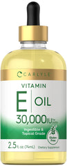 Carlyle Vitamin E Oil bottle with dropper for easy topical moisturization.