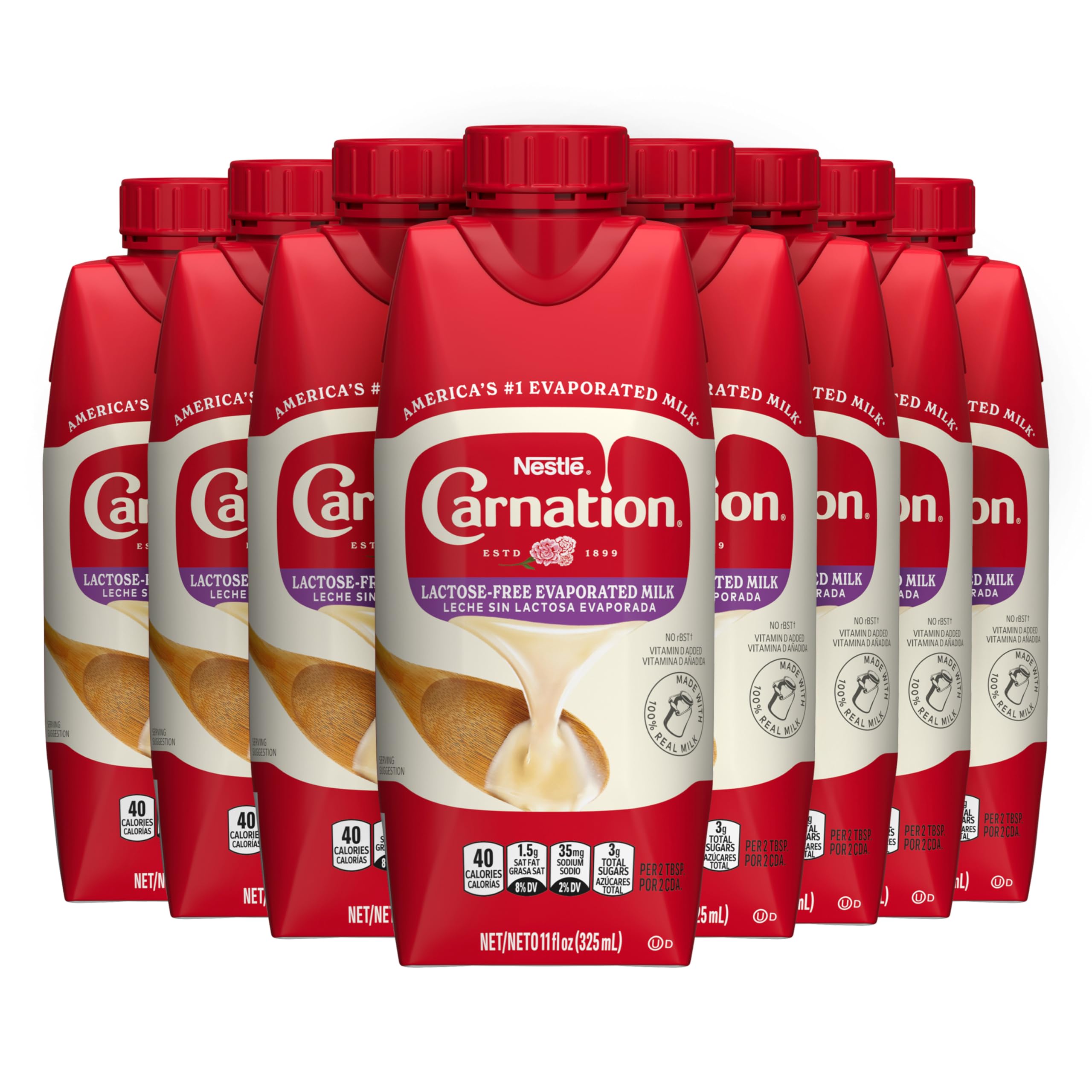 Carnation lactose-free evaporated milk bottle pouring to show creamy texture for cooking