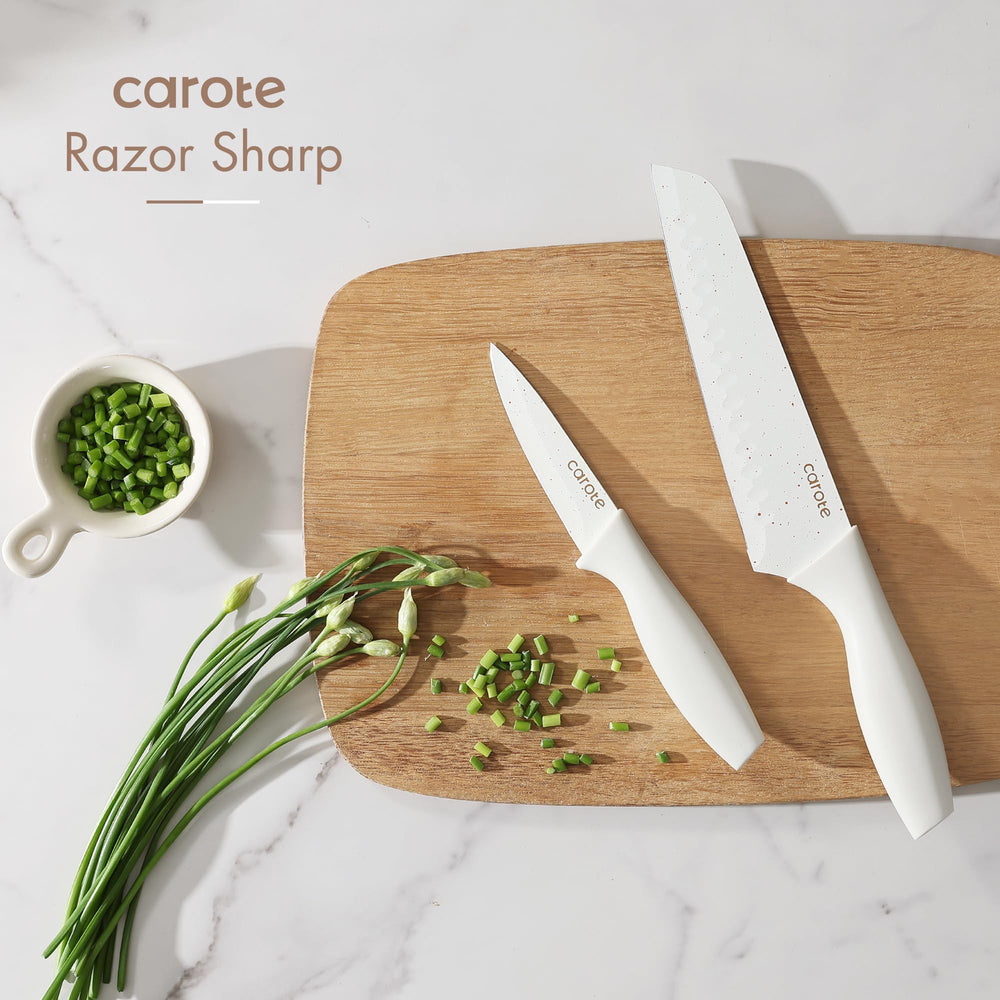 CAROTE paring knife with white handle enables precise small tasks.